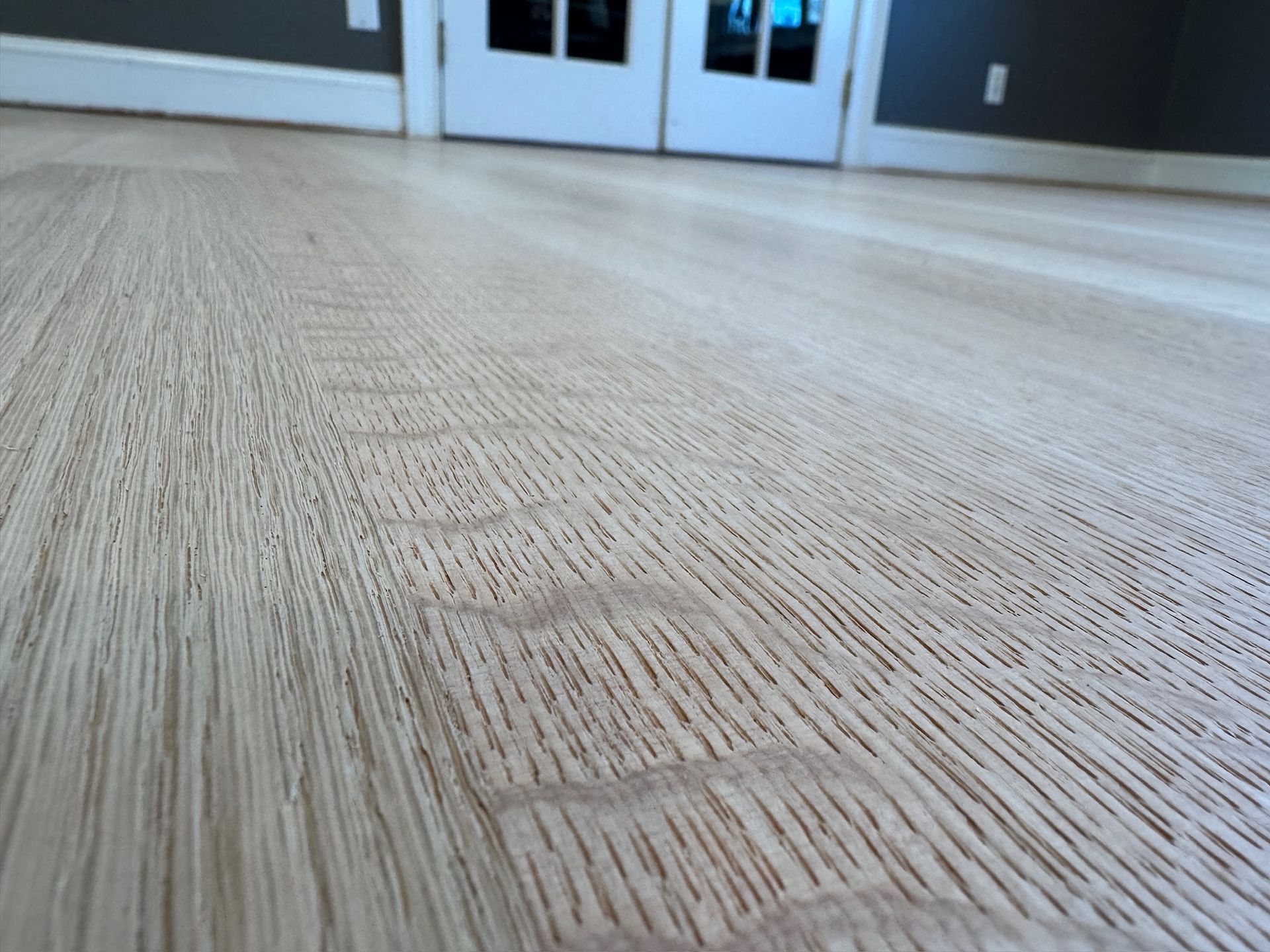 A close up of a wooden floor in a room