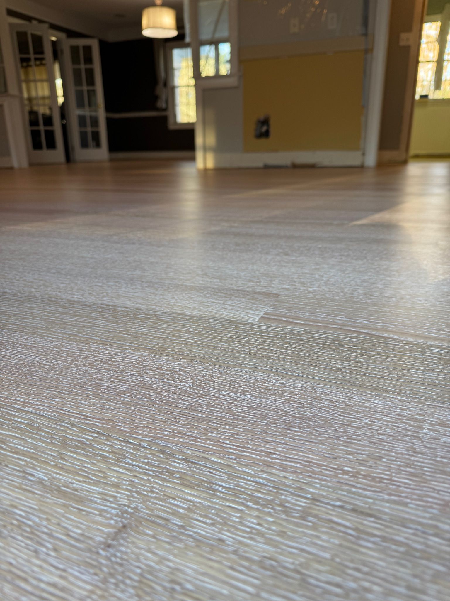 A close up of a wooden floor in a room.