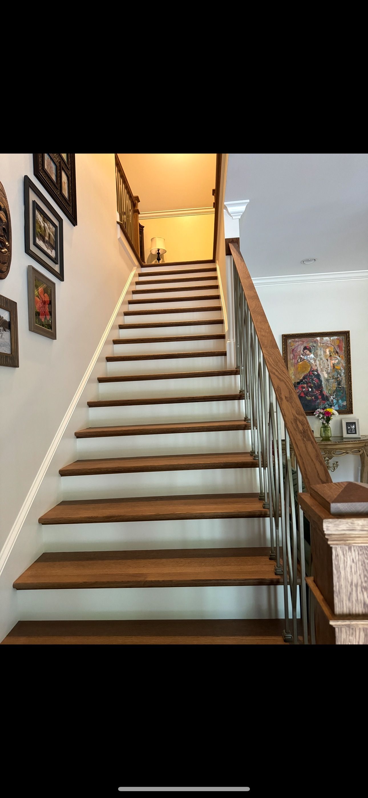 A set of wooden stairs leading up to a second floor in a house.