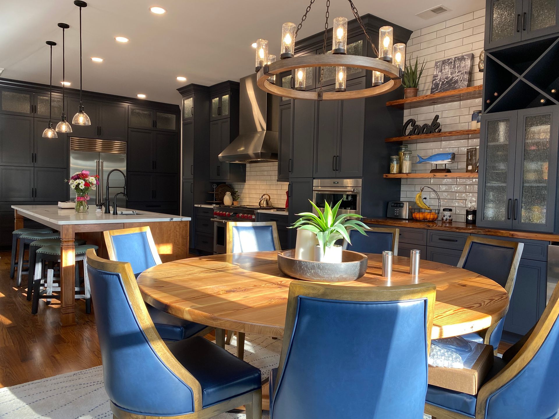 Moody, dark blue kitchen remodel with natural wood accents.
