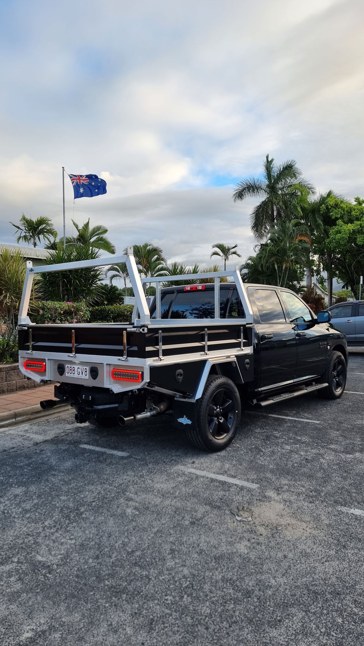 A Trailer with A Canopy Is Parked in Front of A Building — Mingweld Fabrication in Bungalow, QLD