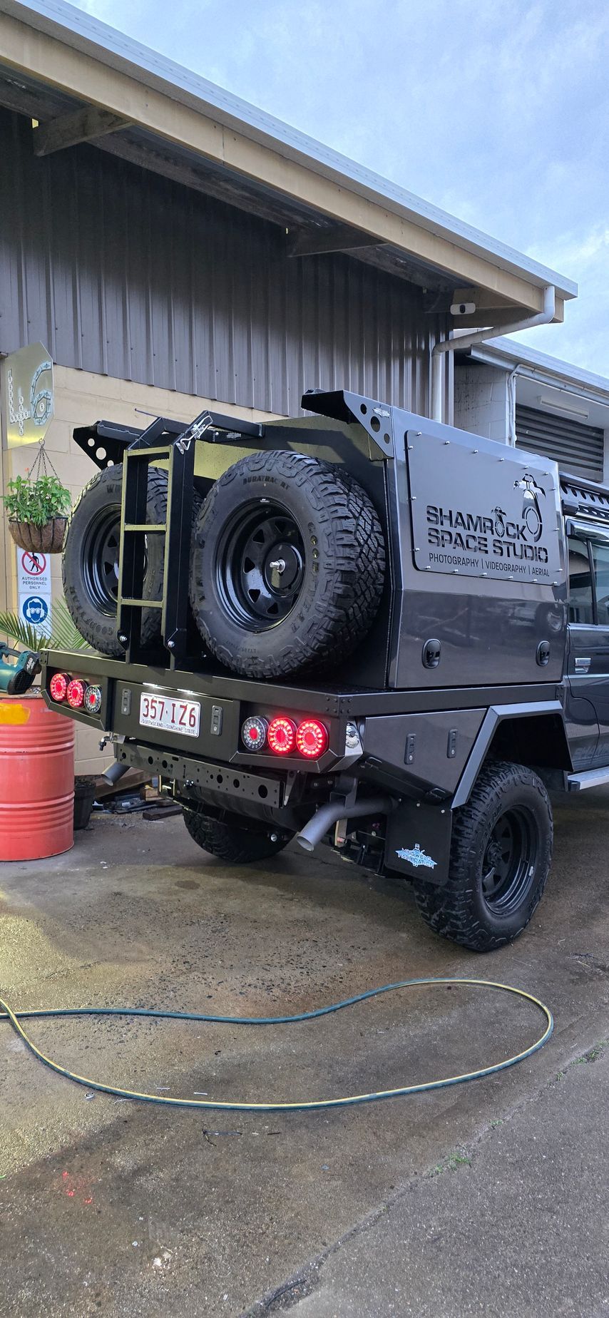 A Large Aluminum Cabinet Is in Front of A Brick Building — Mingweld Fabrication in Bungalow, QLD