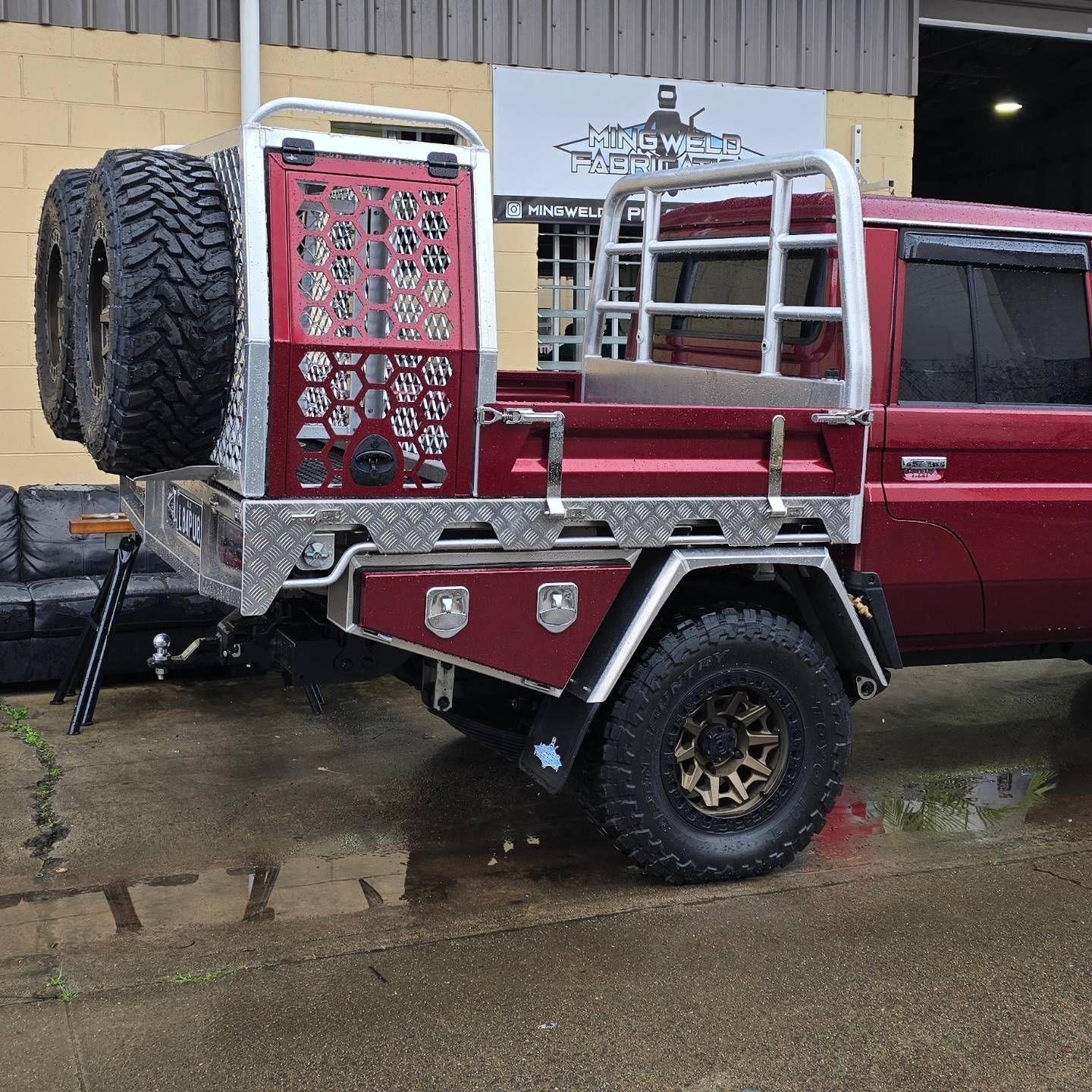 A Black Truck with A Tray on The Back Is Parked in A Car Wash — Mingweld Fabrication in Bungalow, QLD