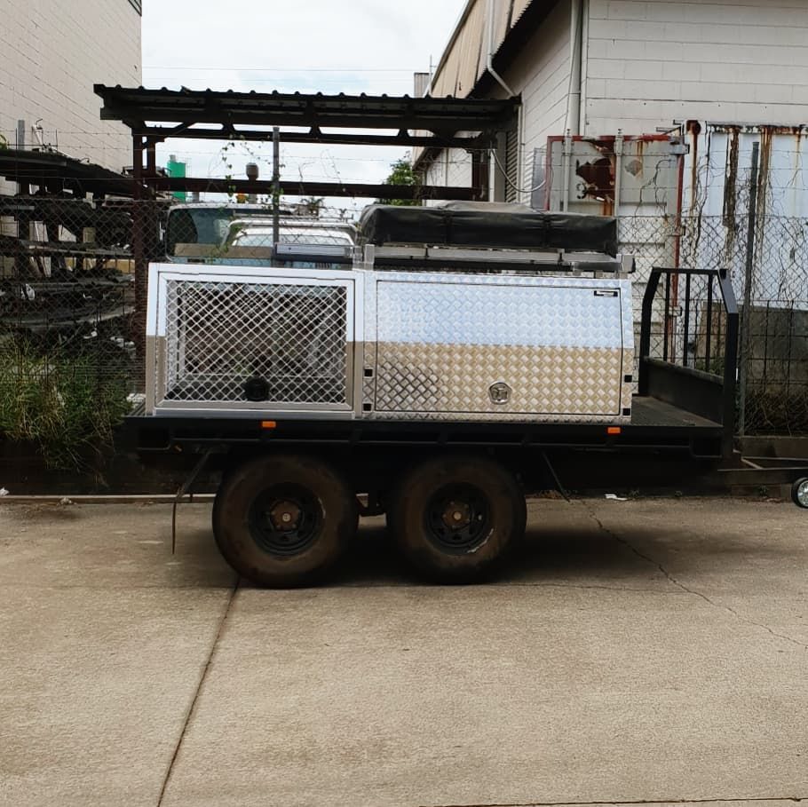 A Truck with A Trailer Attached to It Is Parked in A Parking Lot — Mingweld Fabrication in Bungalow, QLD