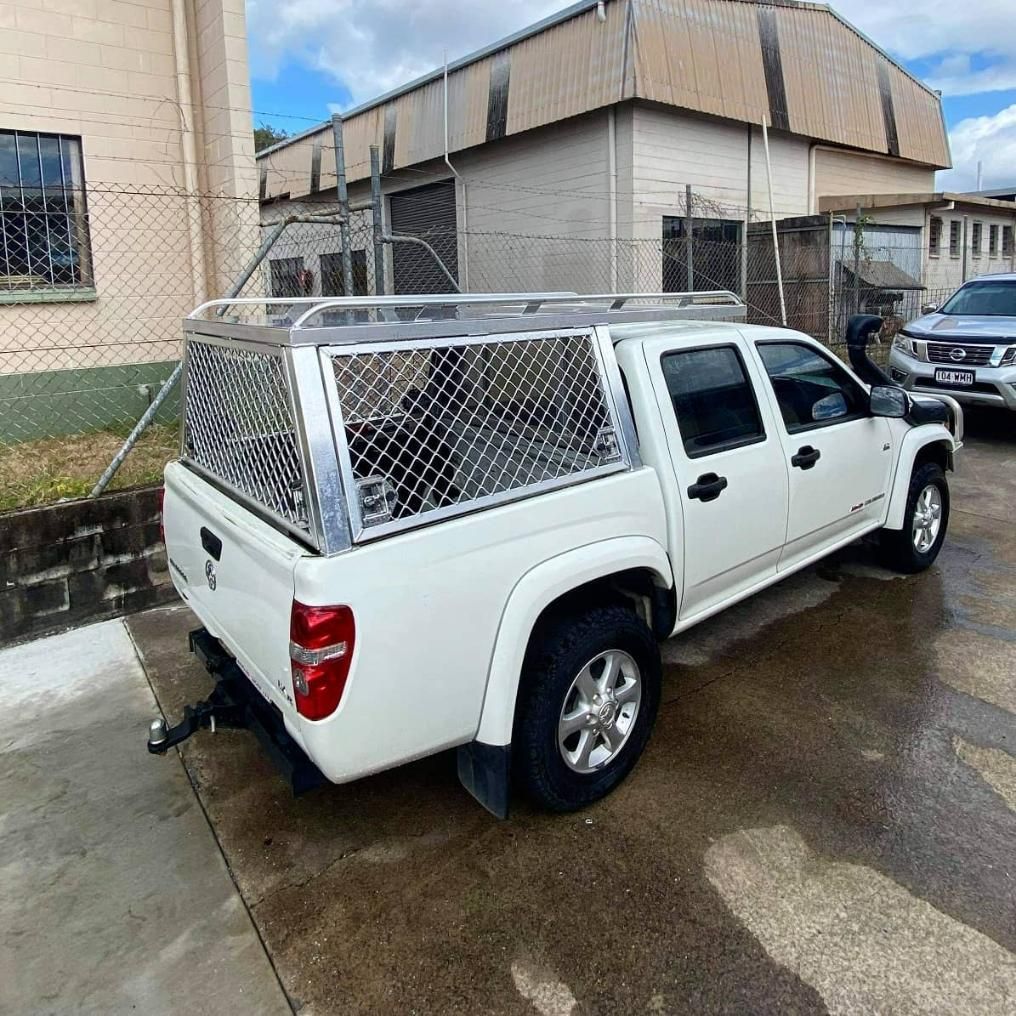 A White Truck with A Canopy Is Parked in Front of A Building — Mingweld Fabrication in Bungalow, QLD