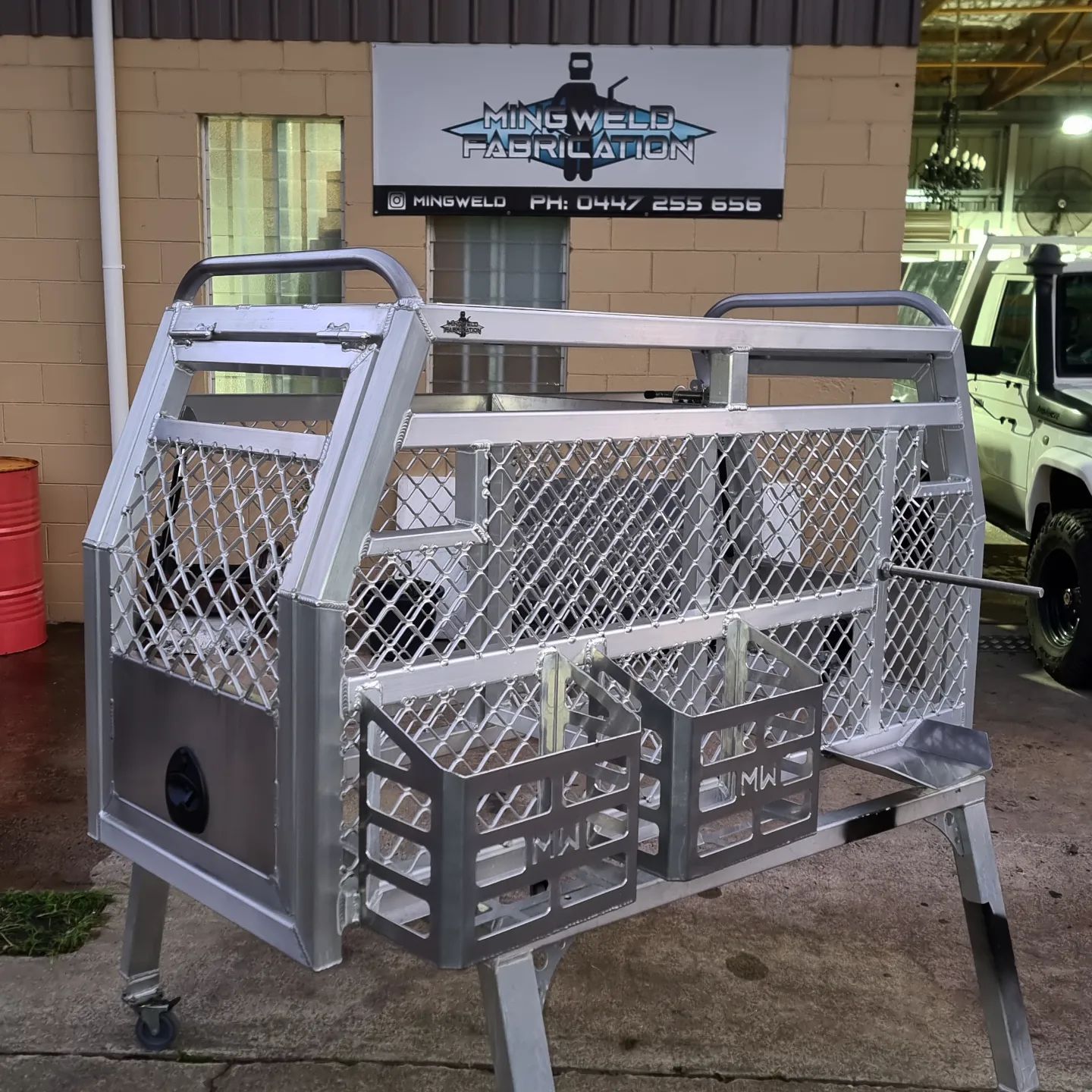Aluminum Truck Bed with Welded Cage, Storage, and Wire Mesh in Front of A Shop — Mingweld Fabrication in Bungalow, QLD