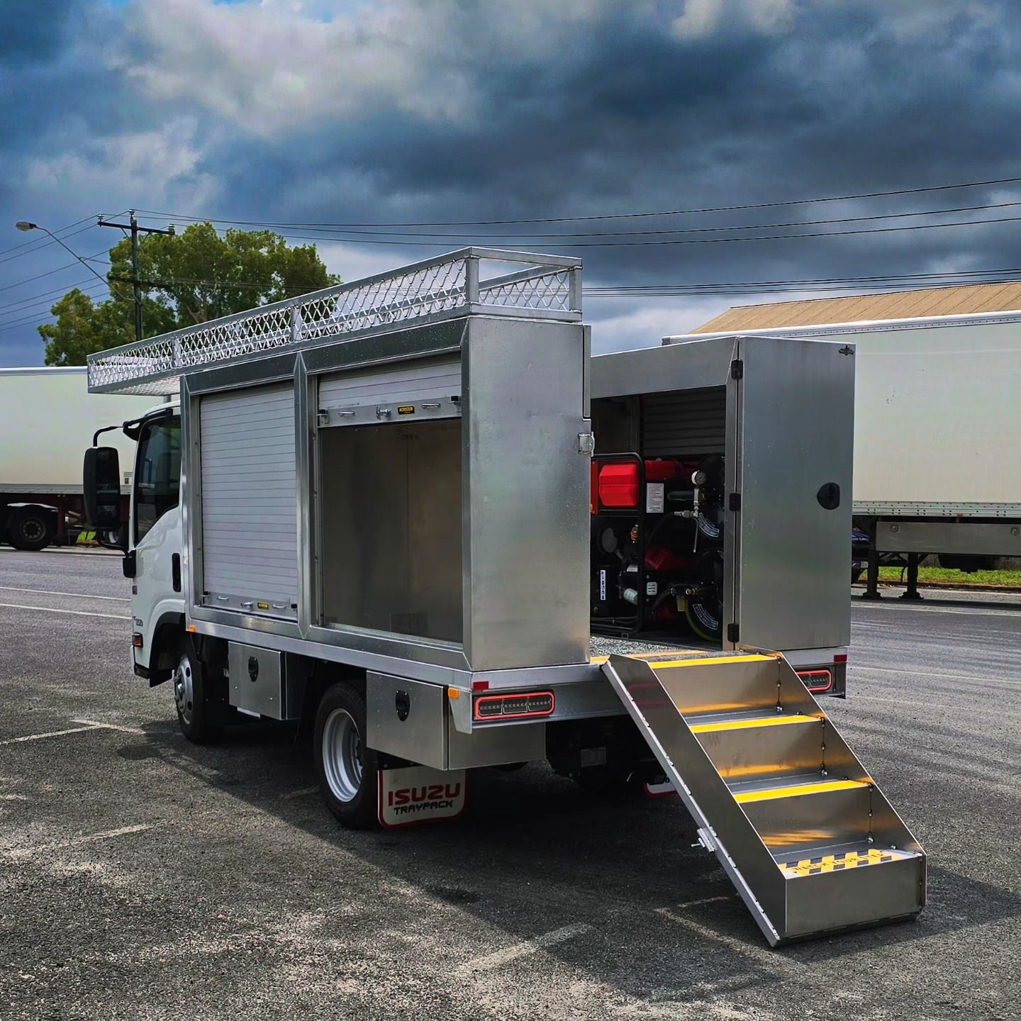 Silver Work Truck with Open Compartments, Ramp — Mingweld Fabrication in Bungalow, QLD