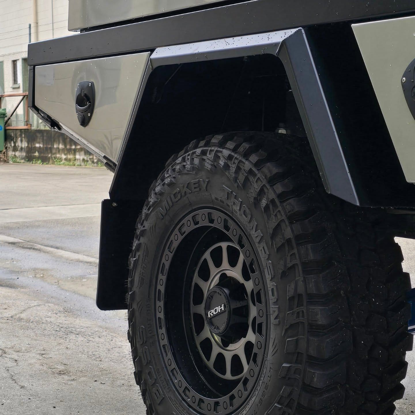 Black Off-Road Tire on A Truck with A Black Fender and A Flatbed, Outdoors — Mingweld Fabrication in Bungalow, QLD