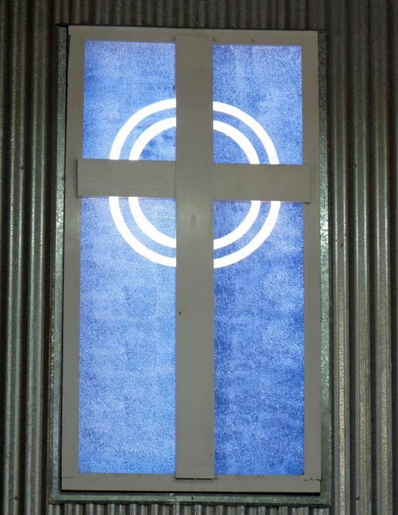 A window with a cross and a circle on it