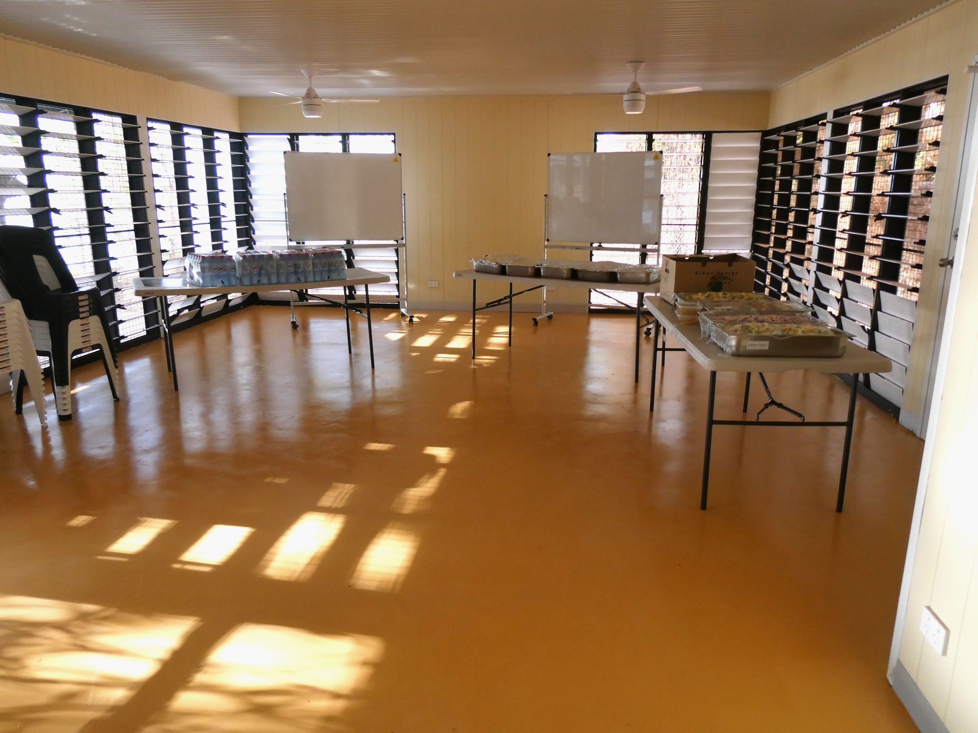 A large room with tables and chairs in it