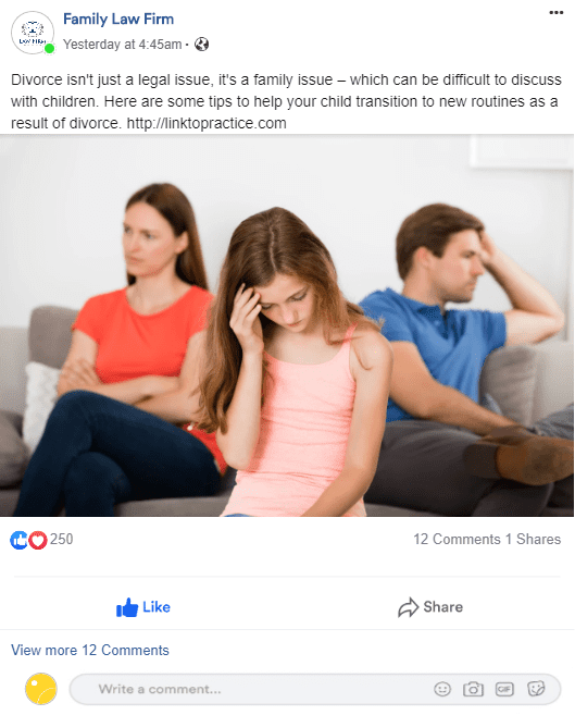 A woman is sitting on a couch talking on a cell phone while a man and woman sit behind her.