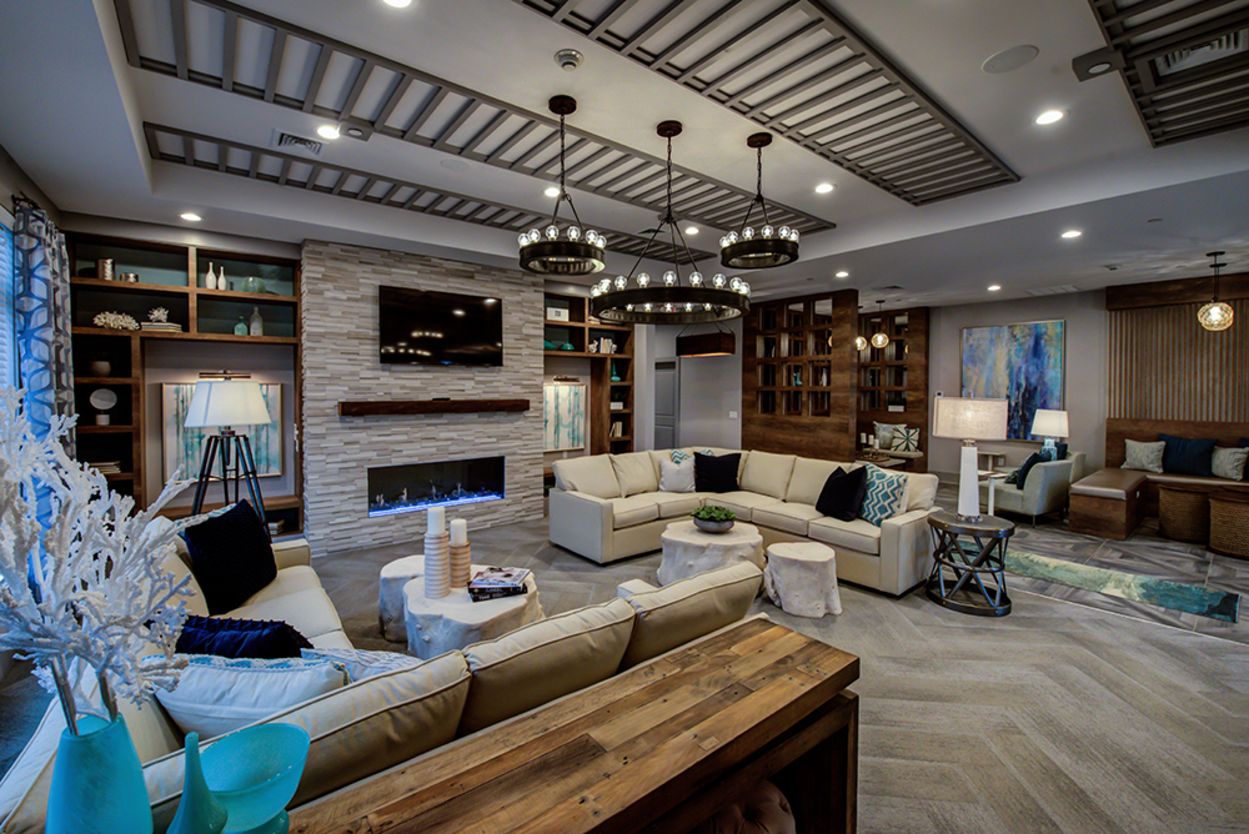 A living room filled with furniture and a fireplace.