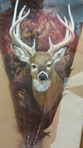 A painting of a deer with an arrow in its head.