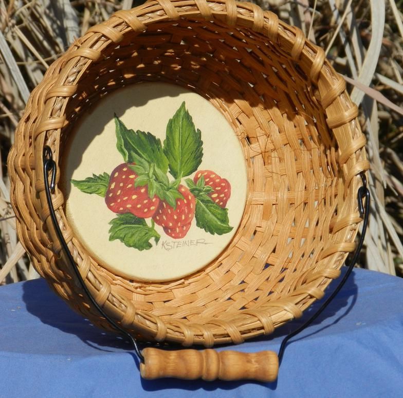 A wicker basket with a picture of strawberries on it