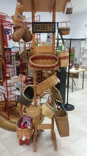 A display of baskets in a store with a sign that says baskets.