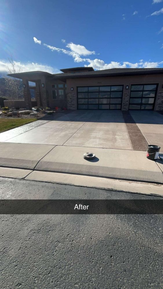Modern house with freshly cleaned concrete driveway.