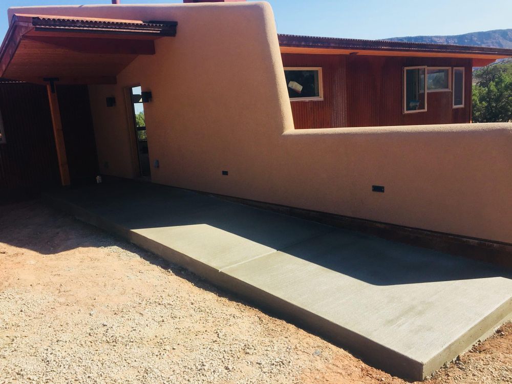 Exterior of a building with a new concrete ramp for accessibility.