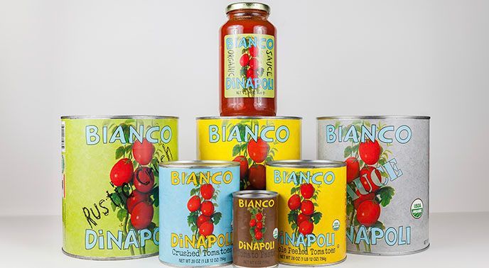 A car with a christmas tree on top of it is sitting on a table.