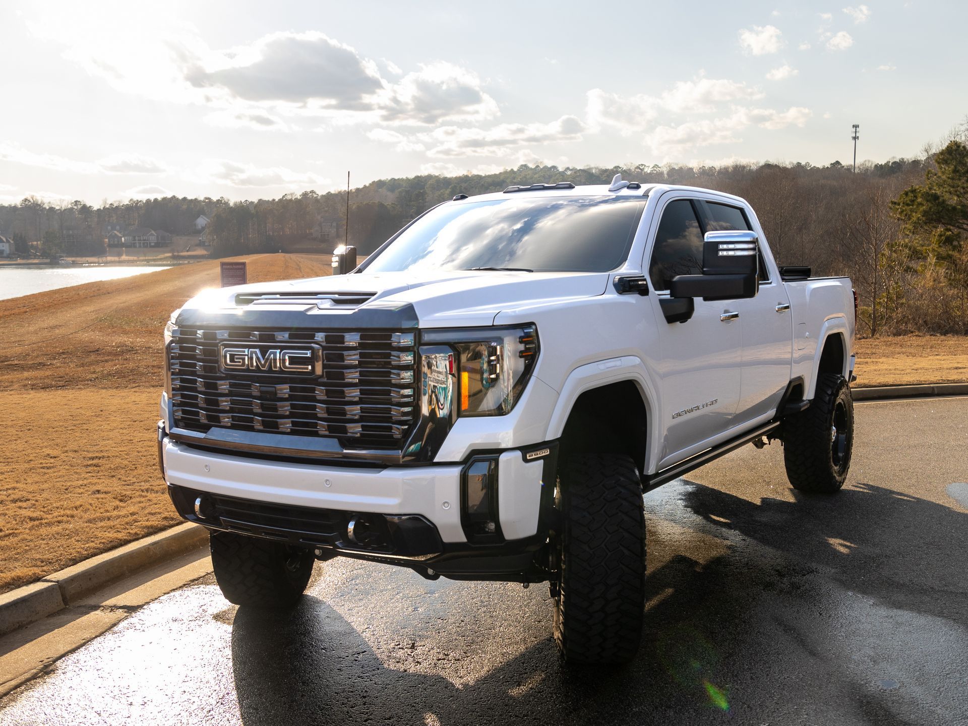 A white truck is parked on the side of the road.