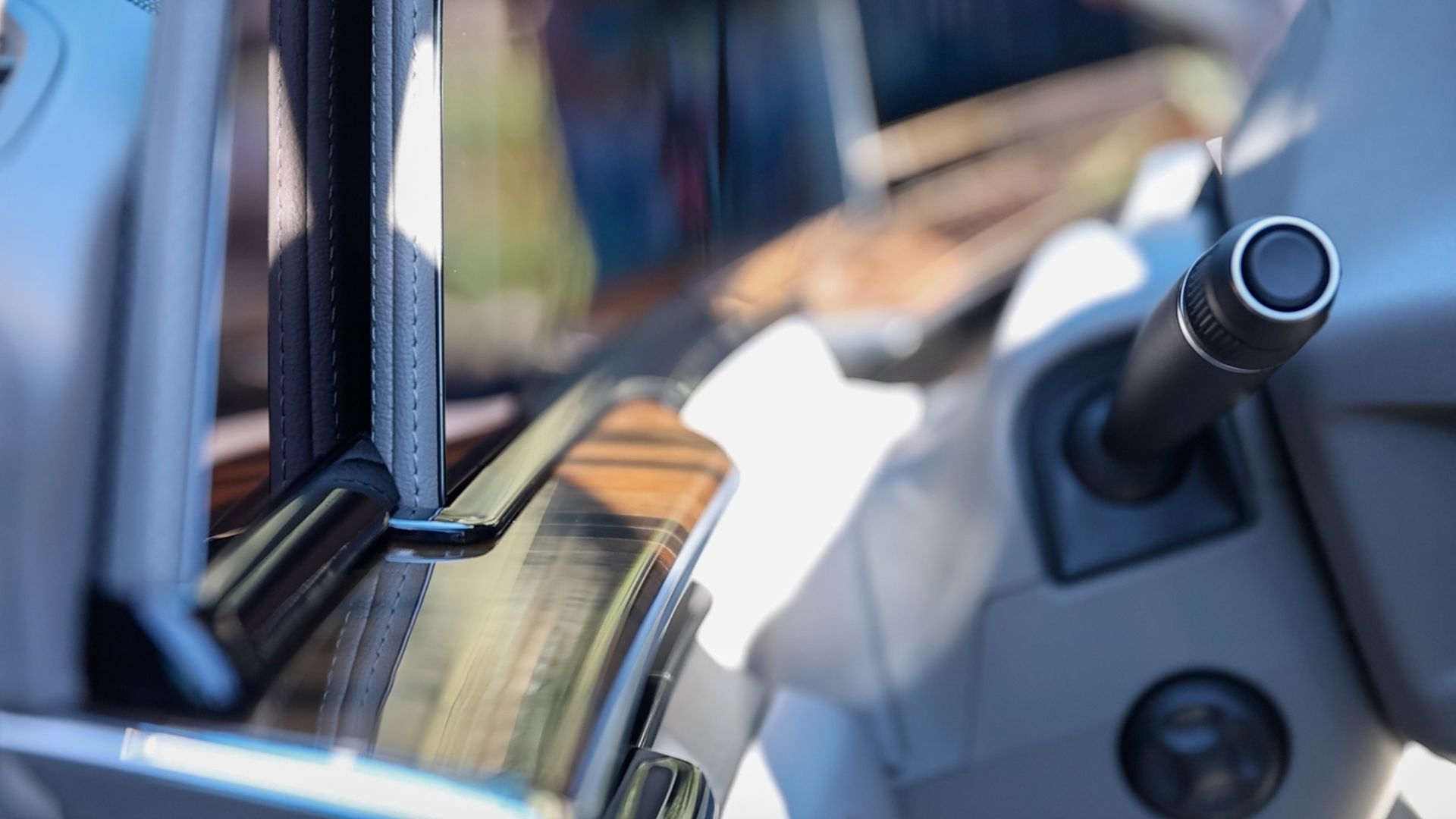 A close up of a steering wheel in a car.