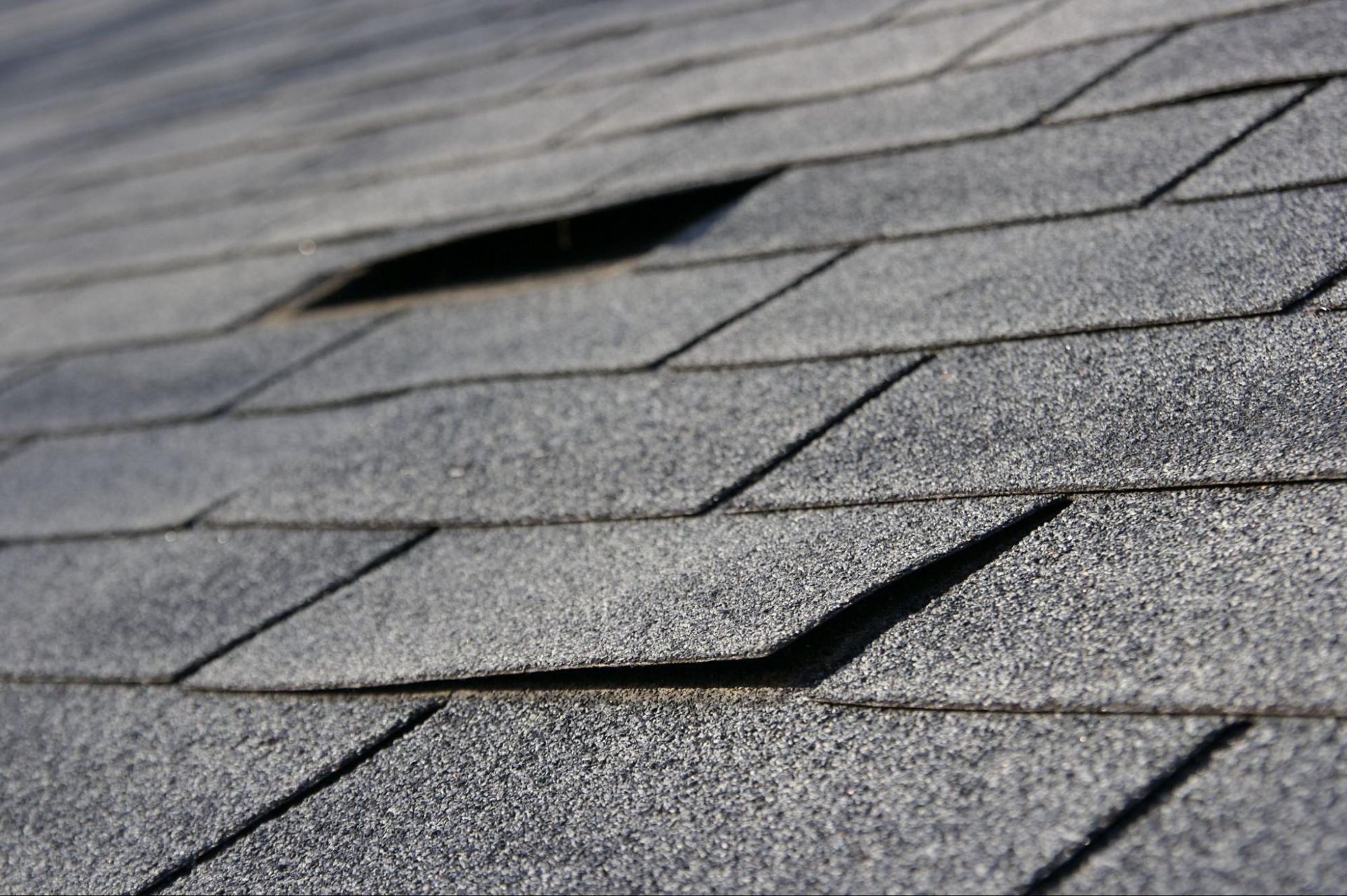 A close up of a roof with a hole in it