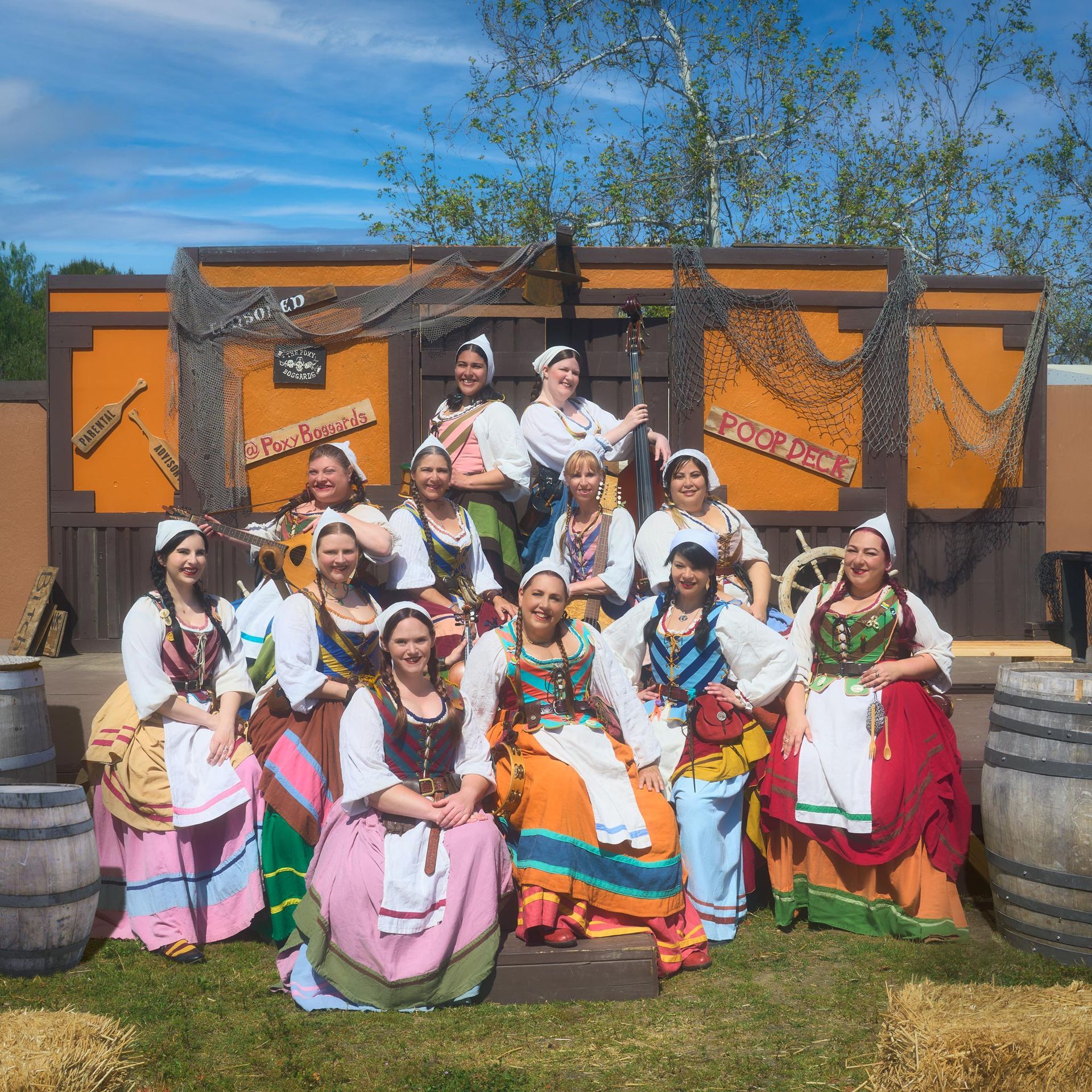 A group of women in costume pose for a picture