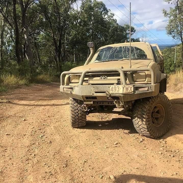 A Toyota Truck Is Parked On A Dirt Road — East Coast Metal Recycling In Brisbane, QLD
