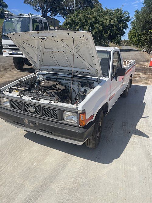 A White Truck With The Hood Up — East Coast Metal Recycling In Brisbane, QLD