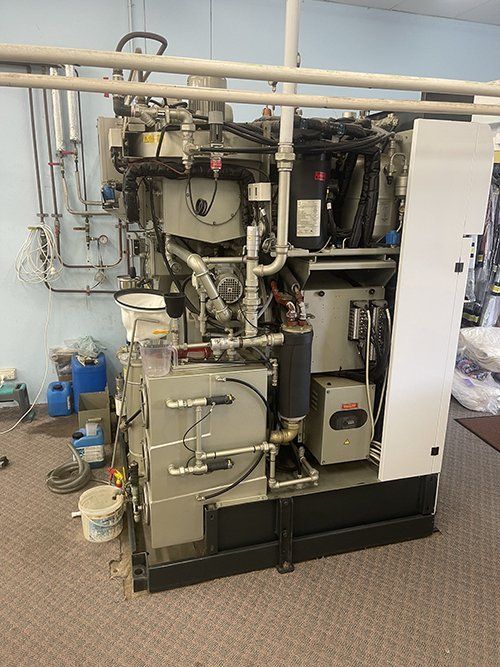 A Large Machine Is Sitting On The Floor In A Room — East Coast Metal Recycling In Tugun, QLD