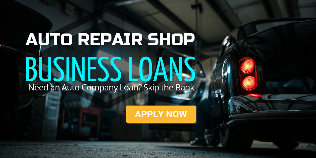 A car is parked in a garage next to a sign that says auto repair shop business loans.
