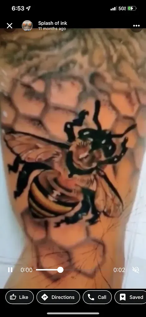 A tattoo of a bee on a person 's arm