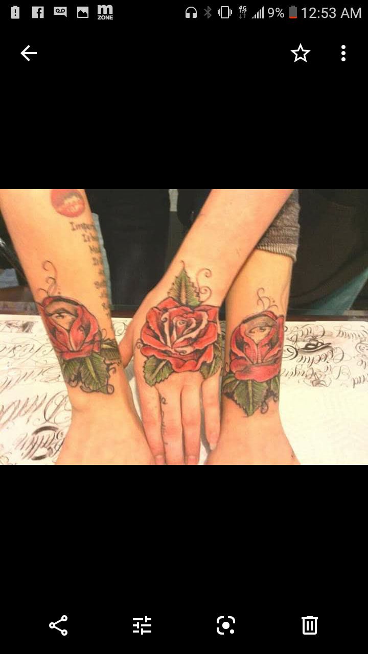 A picture of a woman 's hands with roses on them