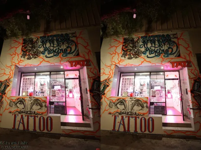 A tattoo shop with a sign that says tattoo on it