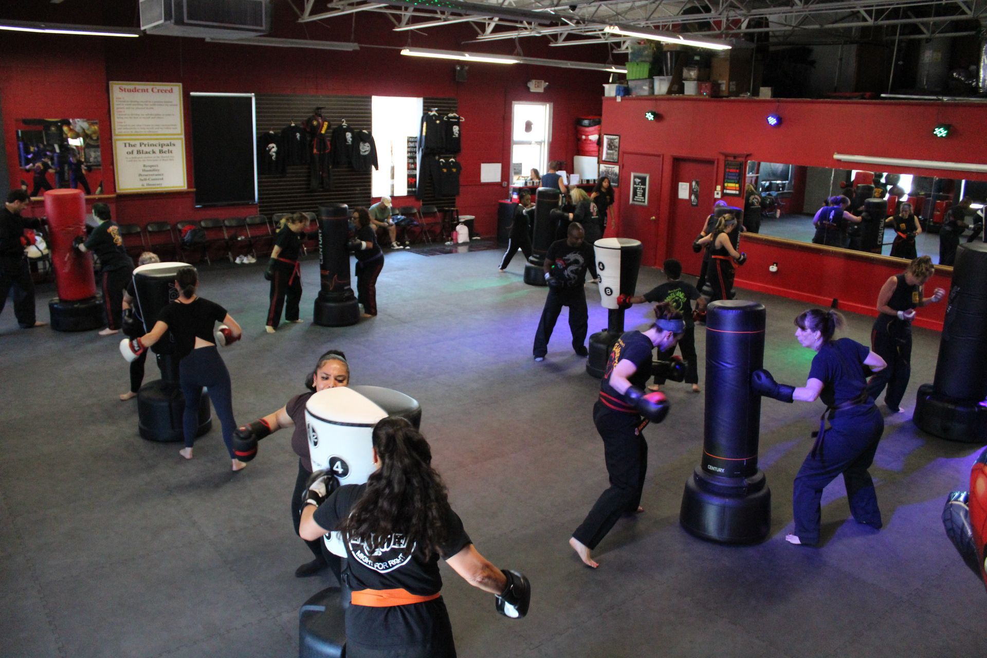 Adult students practicing beginner karate combinations at Karate World in Kenilworth, NJ for fitness and confidence.