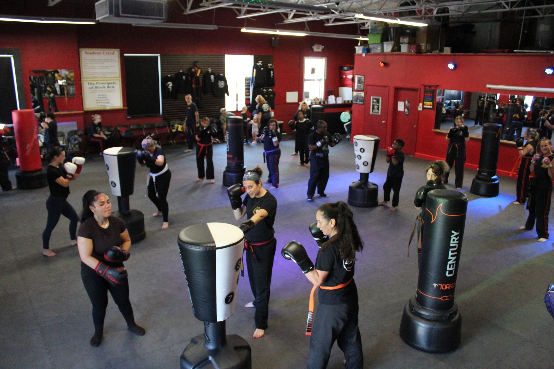 Adults practicing karate drills at Karate World in Kenilworth, NJ, building mental strength and focus.