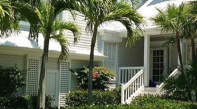 White house with trees - Gutter Service in Port Charlotte, FL