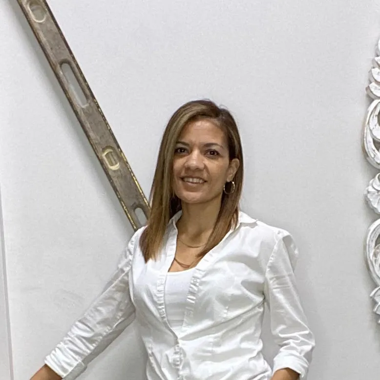A woman in a white shirt is standing next to a level