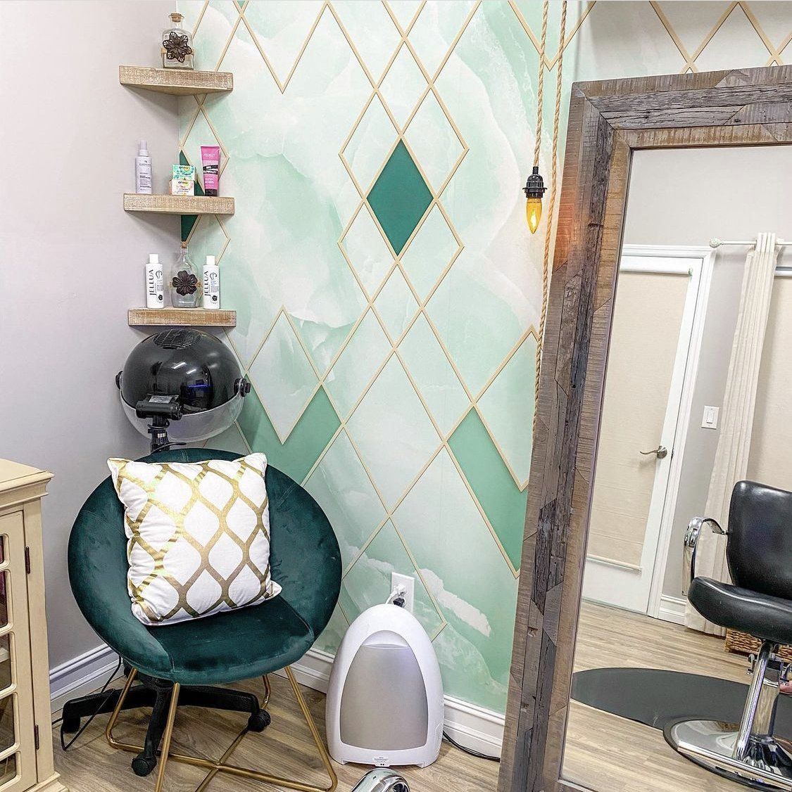 There is a chair with a pillow on it in the room.