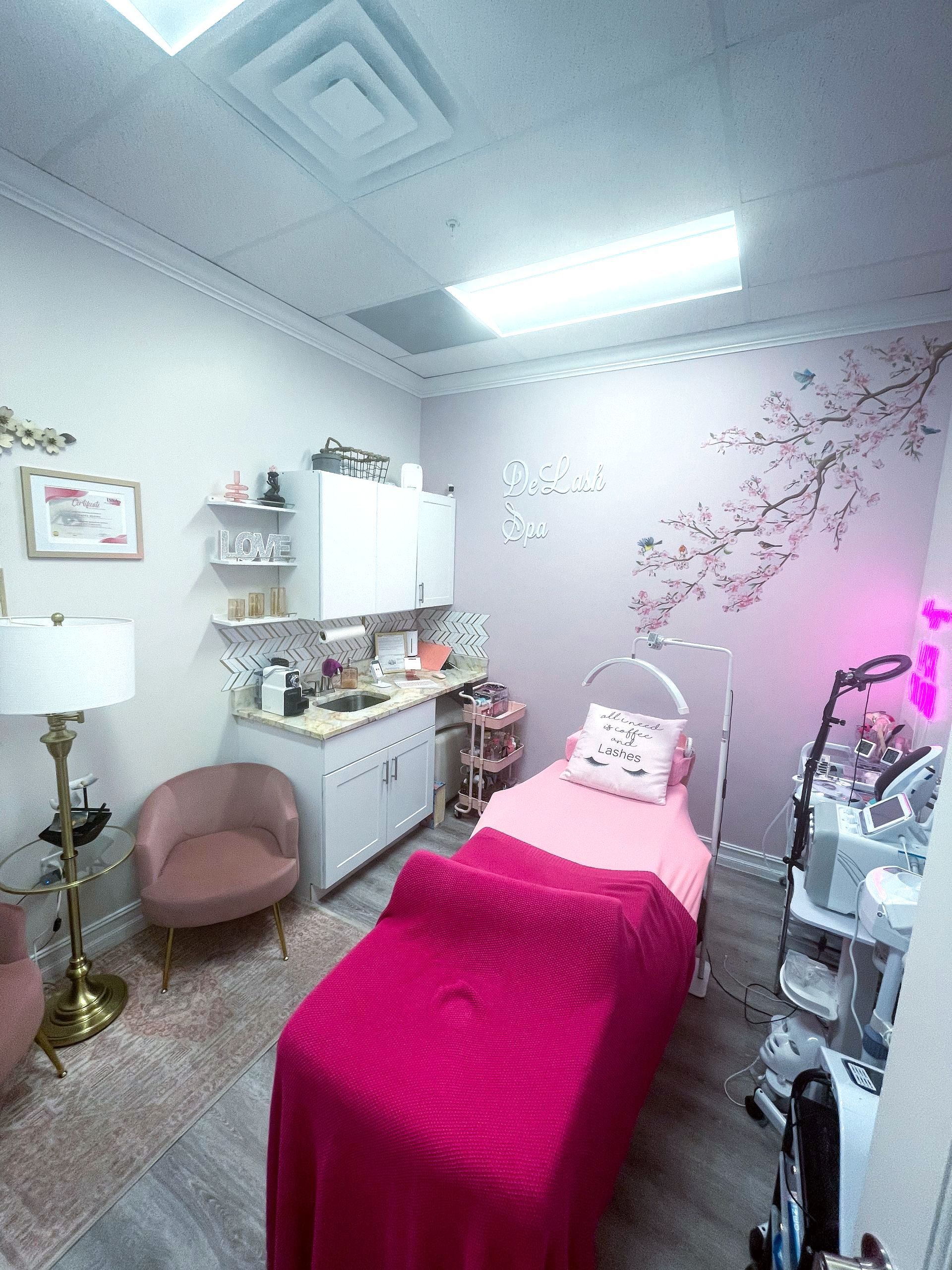 There is a pink bed in the middle of the room.