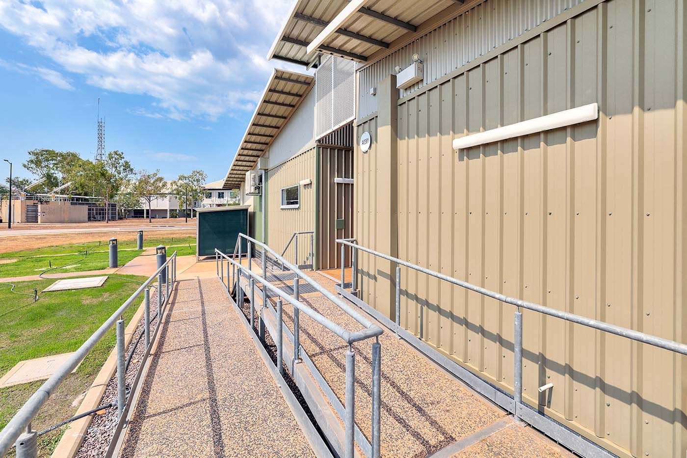Outdoor ramp leading up to defence building entrance 