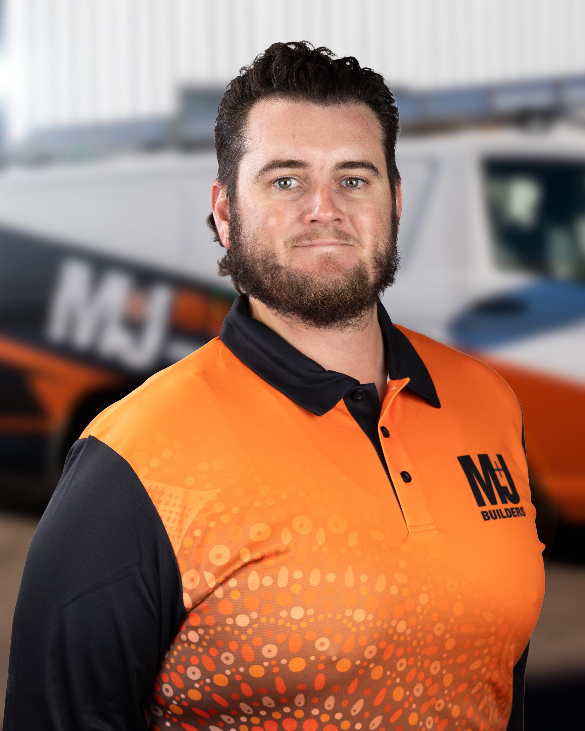 Man wearing an orange shirt with