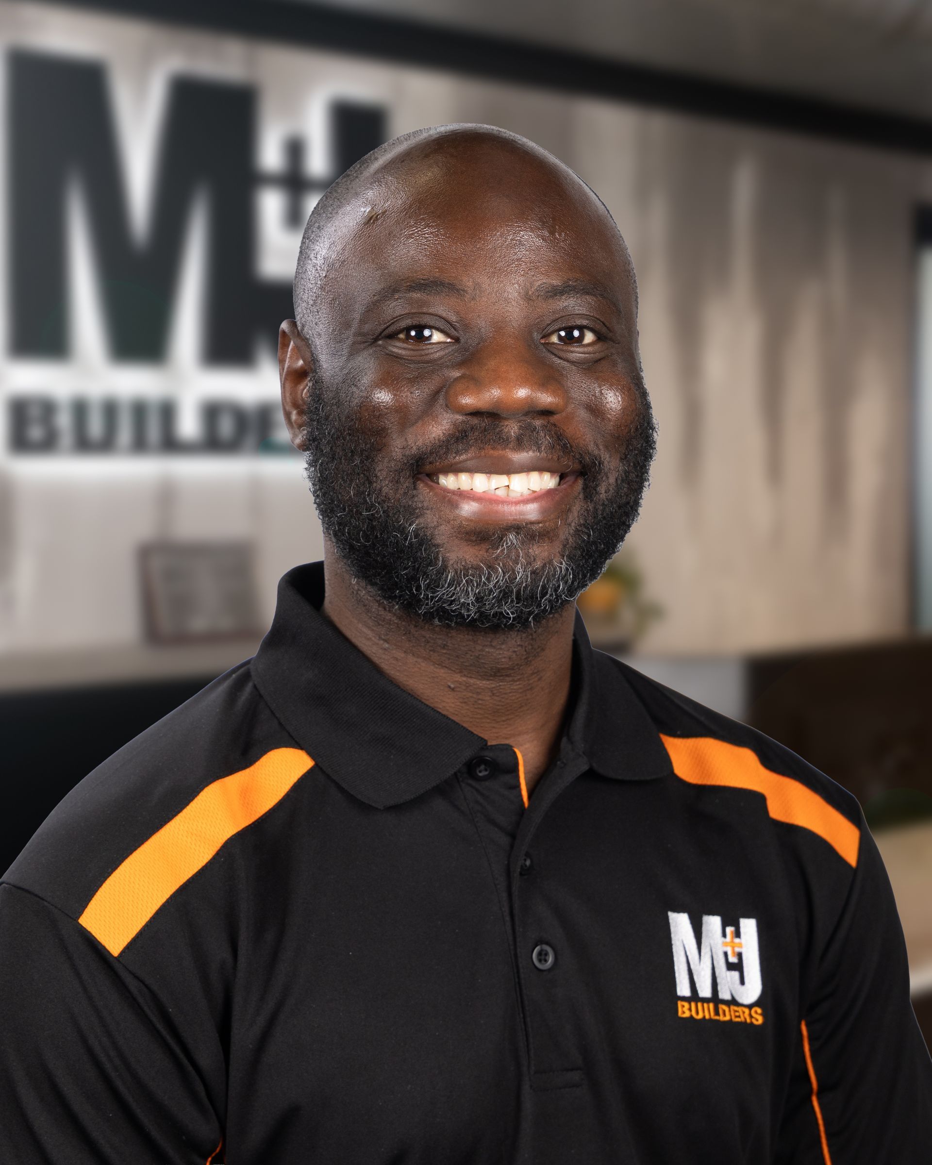 Silhouette of a person against a gray background. Shows head, shoulders, and upper chest.