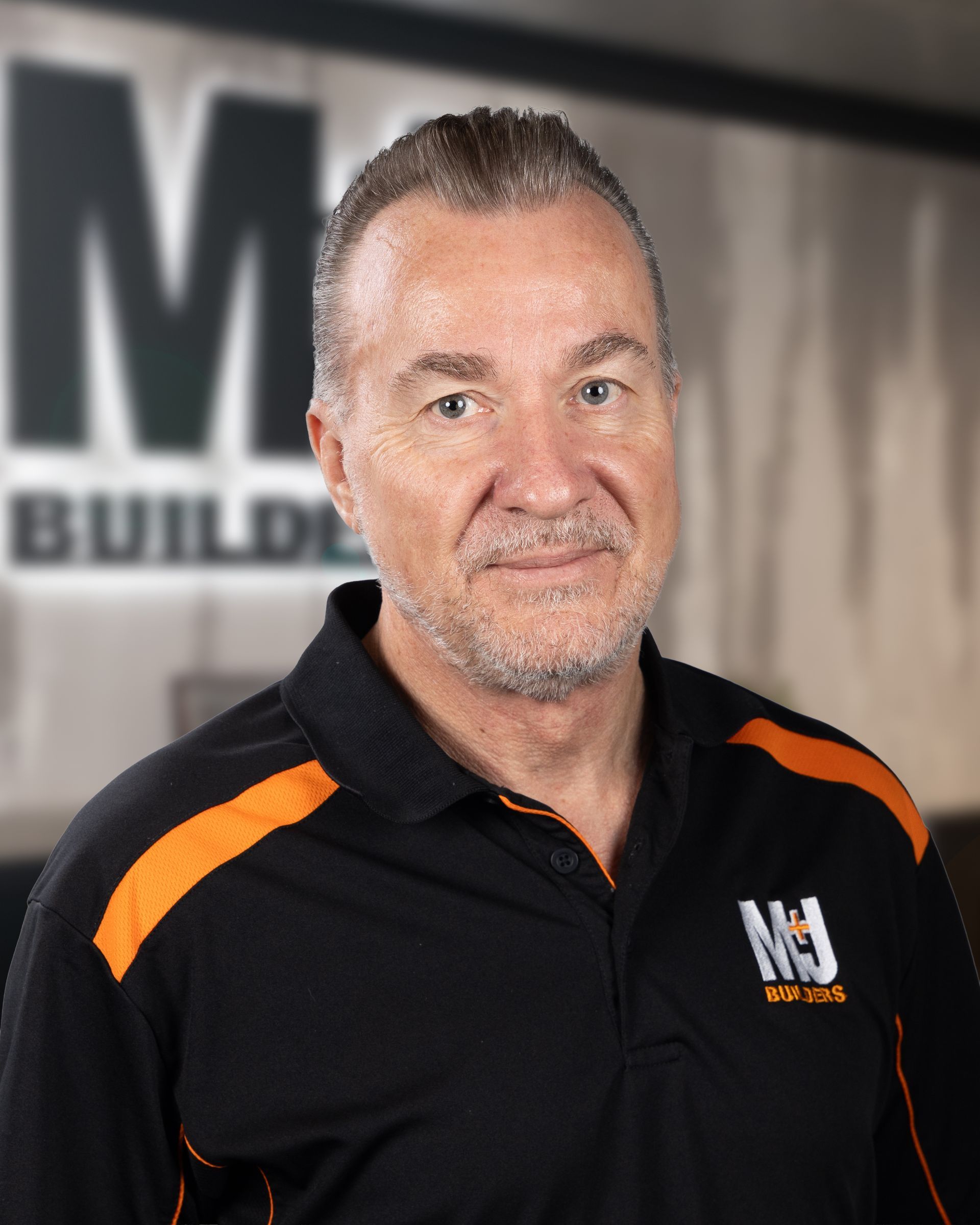 Silhouette of a person against a gray background. Shows head, shoulders, and upper chest.