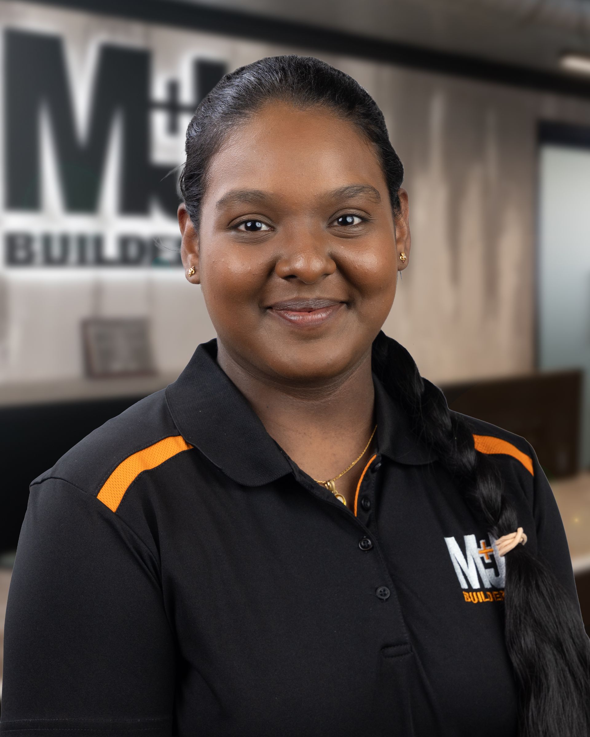 Silhouette of a woman, shoulder-up view. Short hair, gray silhouette on a gray background.
