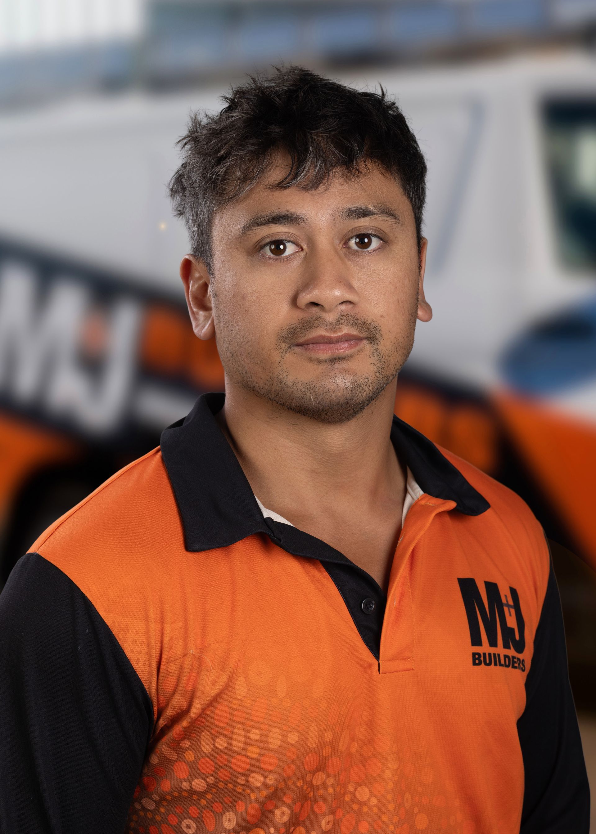 Silhouette of a person against a gray background. Shows head, shoulders, and upper chest.