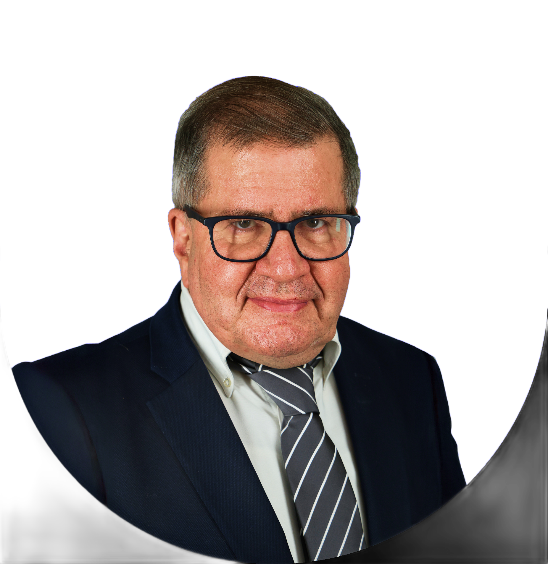 Man in glasses and suit, smiling.