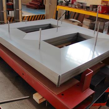 a large piece of metal sitting on top of a table