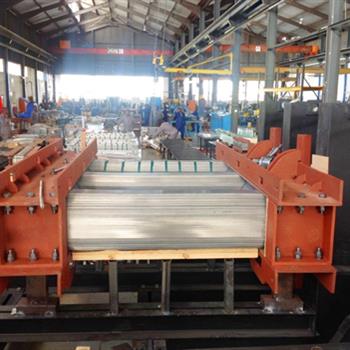 a large machine is sitting in the middle of a factory .