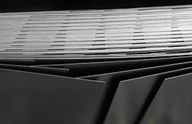 a close up of a stack of metal sheets on a table .