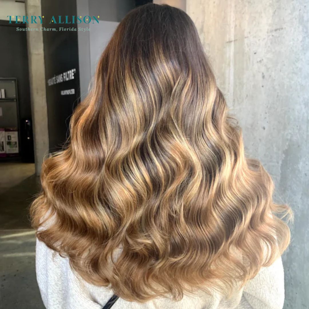 Salon space with bench, sink, chair, and window overlooking a street.